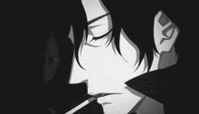 a black and white photo of a man smoking a cigarette