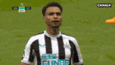a soccer player celebrates a goal during a game on canal