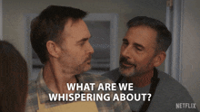 two men looking at each other with the words what are we whispering about on the bottom