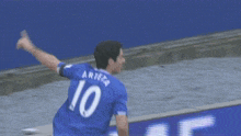 a soccer player wearing a blue jersey with the number 10 on it