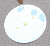 a screenshot of a video game shows a white circle with a yellow smiley face on top ..