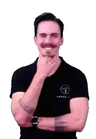 a man with a mustache is wearing a black shirt that says coach on it