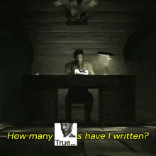 a man sits at a desk with a picture of a man behind him and the words how many s have i written