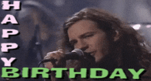 a man singing into a microphone with the words happy birthday written above him