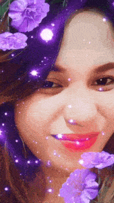 a woman with purple flowers in her hair looks at the camera