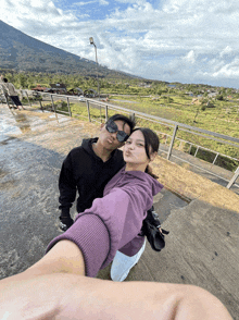 a man and a woman are posing for a picture