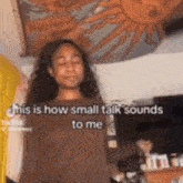 a woman is standing in front of a painting of a sun and says this is how small talk sounds to me