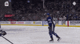 a hockey player with the number 88 on his jersey is skating on the ice