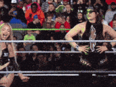 two women in a wrestling ring with one wearing a top that says xx on it