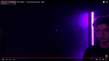 a blurry picture of a man 's face with a purple background and a timer that says 00/05/08