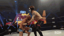 two wrestlers are in a ring with the word roh on the bottom