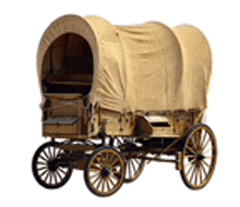 a wooden covered wagon with a canopy and wheels on a white background .