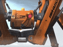 a close up of a robot with a red light and the number 32 on it