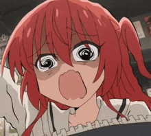 a close up of a girl with red hair making a face