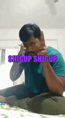 a man sitting on a bed with the words shigup shigup written on the bottom