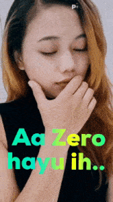 a woman covering her mouth with her hand and the words " aa zero hayu ih " on the bottom