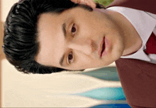 a man with a surprised look on his face is wearing a suit and tie