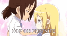 a couple of anime girls are standing next to each other .