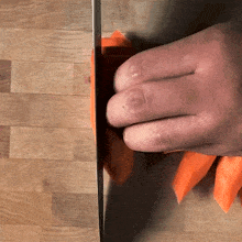 slicing carrots two plaid aprons cutting carrots making thinly sliced carrots preparing food