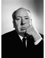a black and white photo of a man in a suit and tie holding his hand to his chin .
