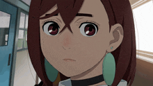 a close up of a girl 's face with a choker and green earrings