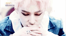 a close up of a person 's face with the words your moments kpop on the bottom