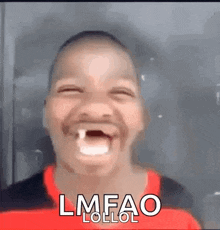 a young boy with a tooth in his mouth is making a funny face and the words lmfao lollol are visible