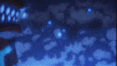 a close up of a blue glowing object with a black background