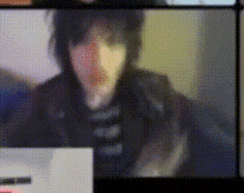a blurry picture of a person 's face with a sign in the foreground that says ' lg ' on it