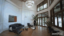a woman stands in a living room with the words made in animotica above her