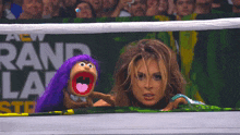 a woman and a puppet are in front of a banner that says rand lane