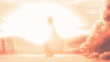 a person is standing in front of a sunset with a large sun shining through the clouds .