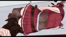 a girl in a red pleated skirt is laying down on the floor