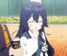 a girl is holding a can of coffee that says black