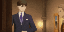 a man in a suit and tie is standing in a room