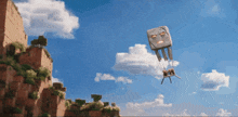 a parachute with a face on it is flying through the sky