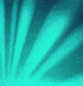 a turquoise background with a fan shaped design