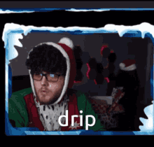 a man wearing glasses and a santa hat with the word drip in the corner