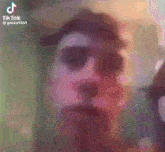 a close up of a person 's face with tiktok written on the bottom right