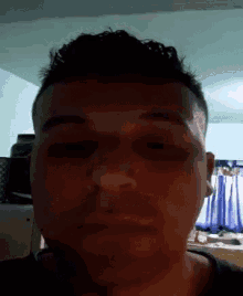 a close up of a man 's face with his eyes closed .