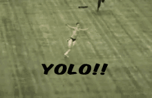 a man without a shirt is running on a field with the word yolo behind him