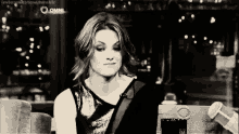 a black and white photo of a woman with the word omni on the bottom right
