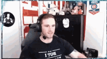 a man wearing headphones and a t-shirt that says ' i tub ' on it