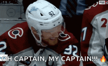 a hockey player wearing a helmet with the number 92 on it