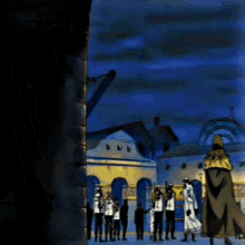 a group of people are standing in front of a building with a blue sky behind them