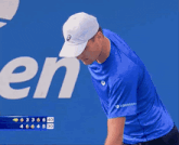 a man wearing a blue shirt that says 888payk on it