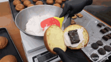 a person is making a cake on a scale that says cas on it
