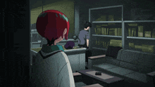 a man and a woman are standing in a dark room with a couch and a cartoon character with the letter k on its face