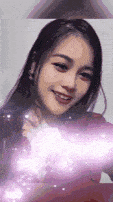 a close up of a woman 's face with a purple glow