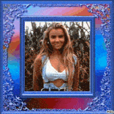 a picture of a woman in a crop top in a blue frame .